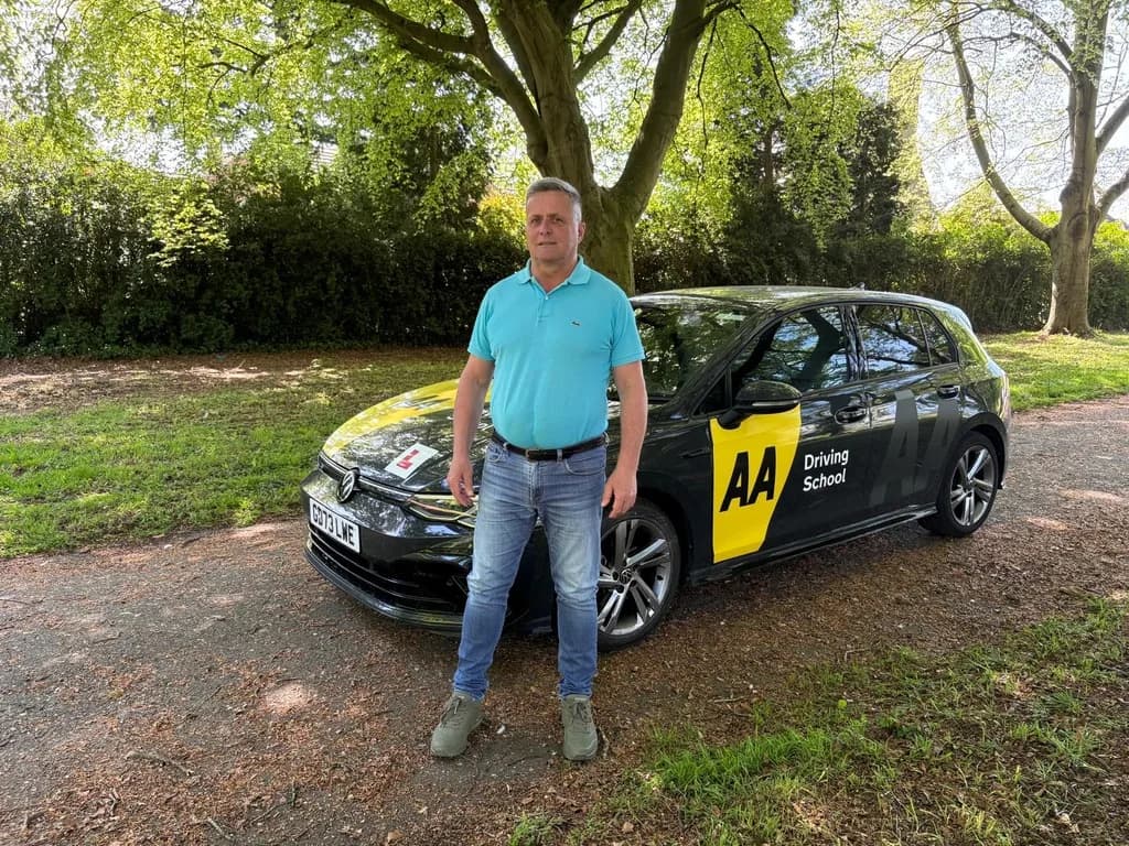 Maurizio Gobbato, DVSA-approved Advanced Driving Instructor at DrivePro Midlands, standing with the dual-control learner car in the East Midlands